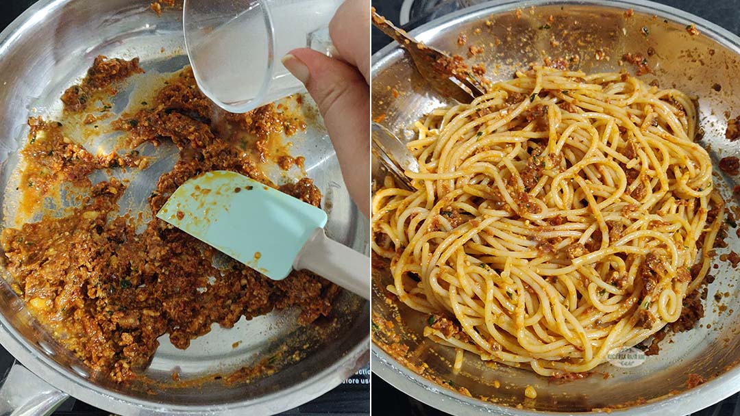 Tossing cooked pasta in tomato pesto sauce.
