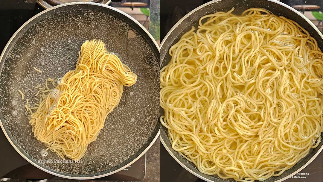 Boiling hakka noodles in a pot.