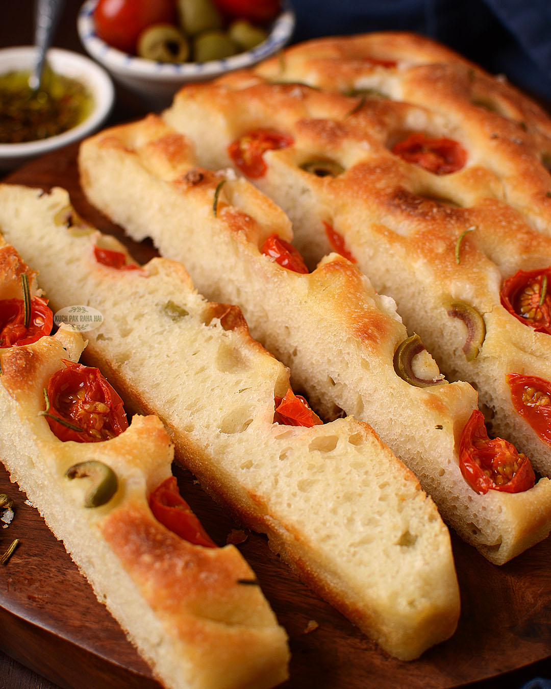 Focaccia bread slices served with olive oil dip.