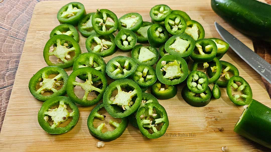 Slicing jalapenos.