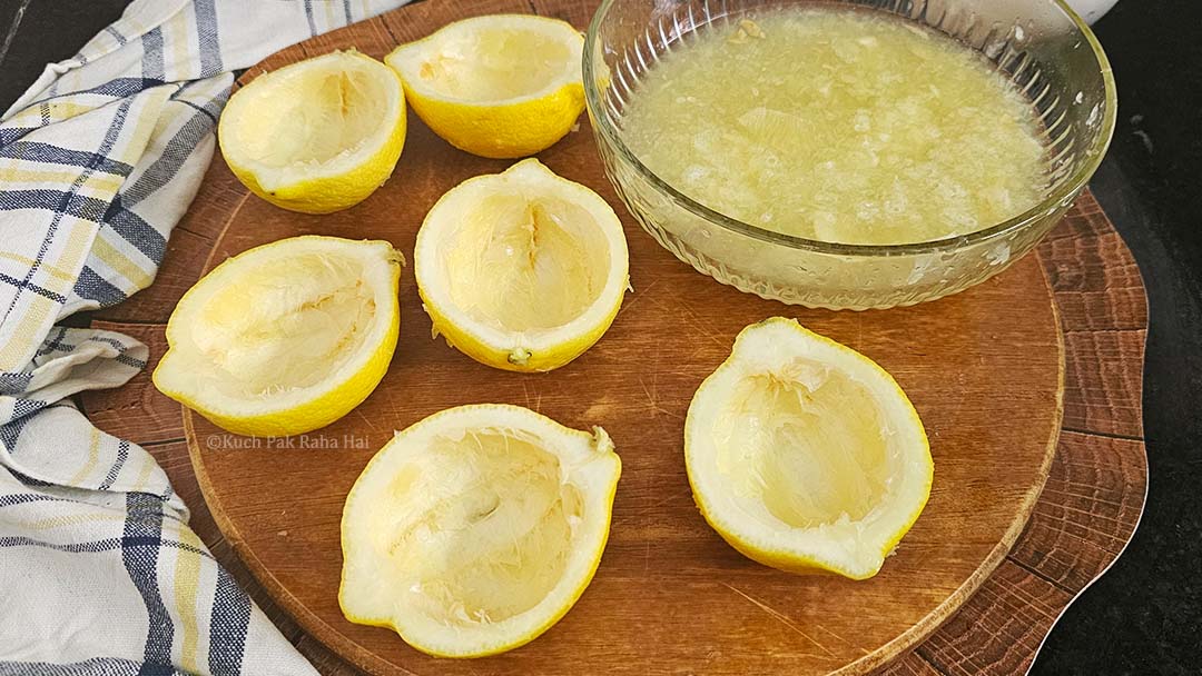 Separating lemon pulp from peel.
